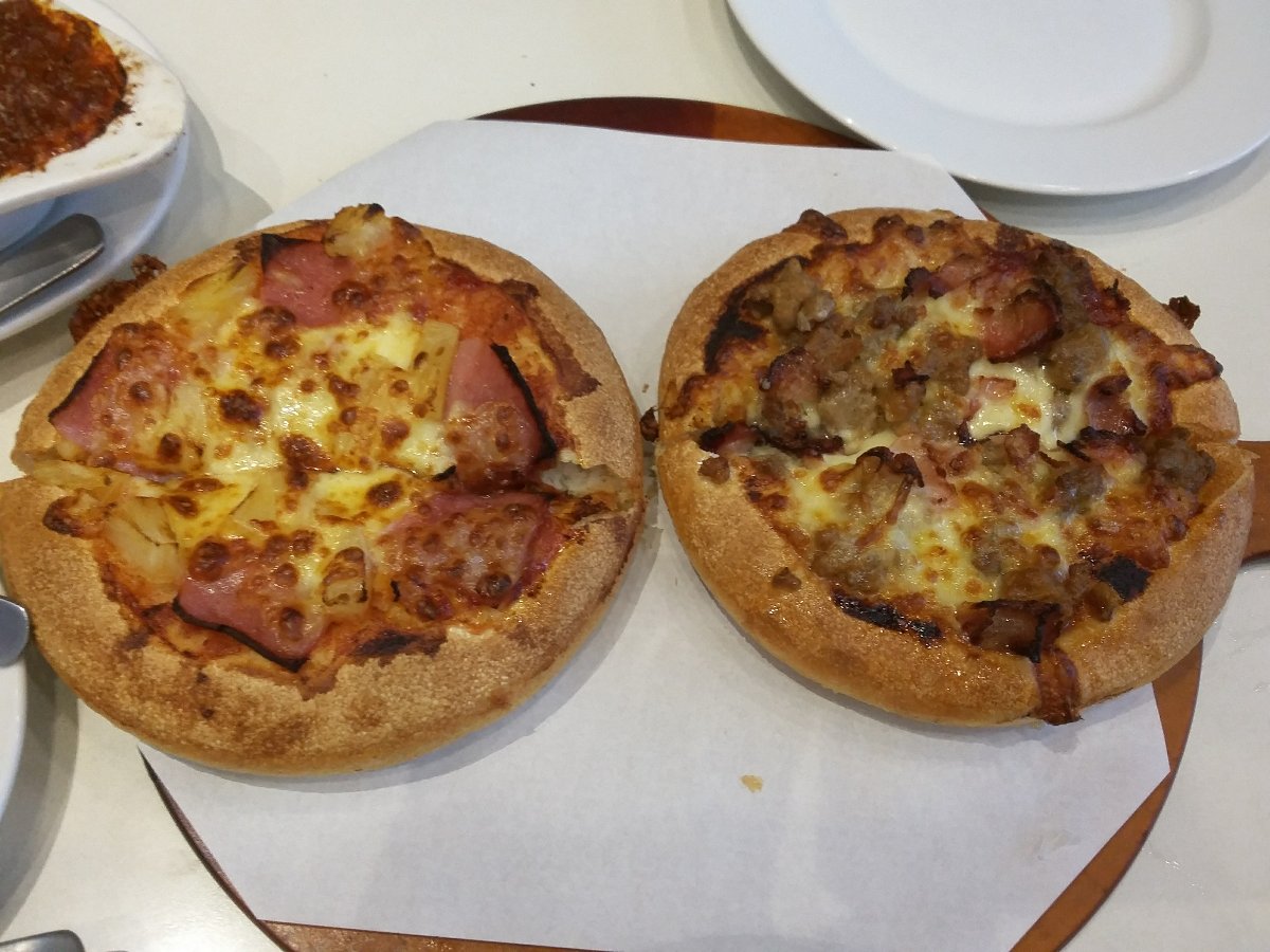 Two hawaiian pizza, at pizza hut