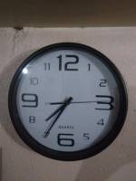 what time is it time check seven thirty five pm black and white large numbers