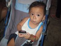 baby gaven holding cellphone