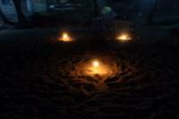 Candle in the sand