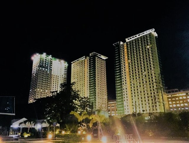 the view of I. T Park Cebu, at night, tall buildings
