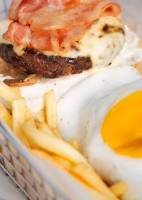 Egg, fries, bacon, burger