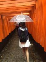 girl using umbrella rainy days