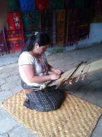 making a traditional rug in guatemala