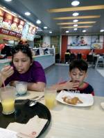 Grandmother and grandson at Chowking