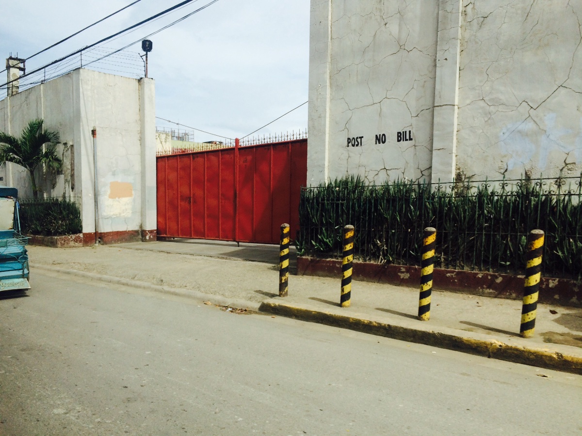 bright red gate by the road