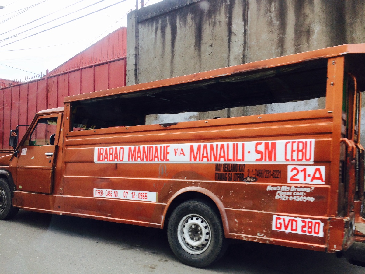 jeepney parking at the side of the road