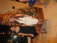 Christmas party, wearing their best outfit. 