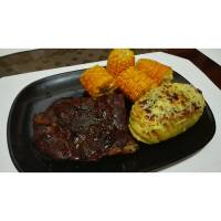 steak with baked potato and sweet corn