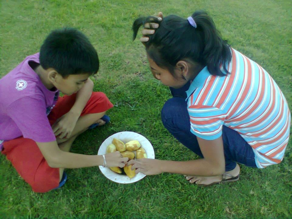 busy eating mangoes