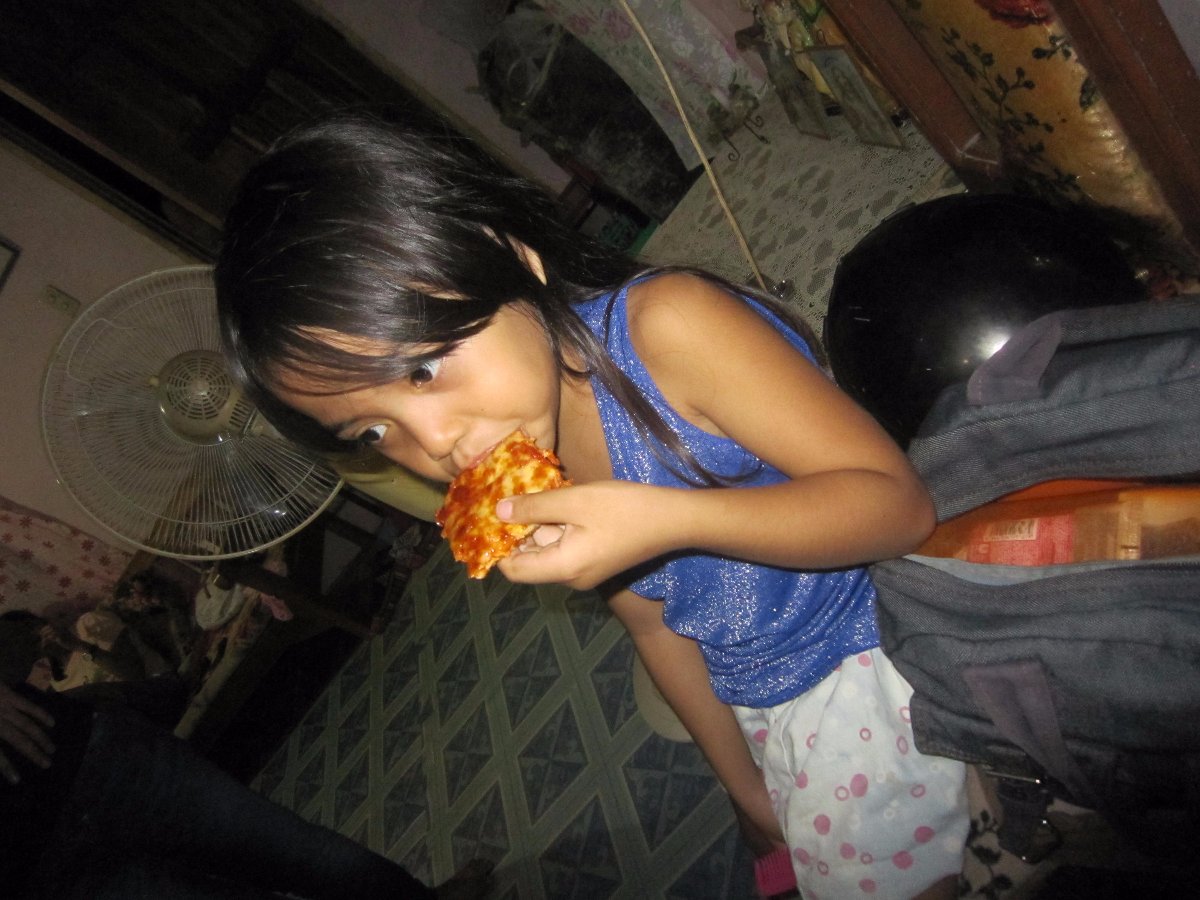 cutie kiddo mikang eating pizza yummy