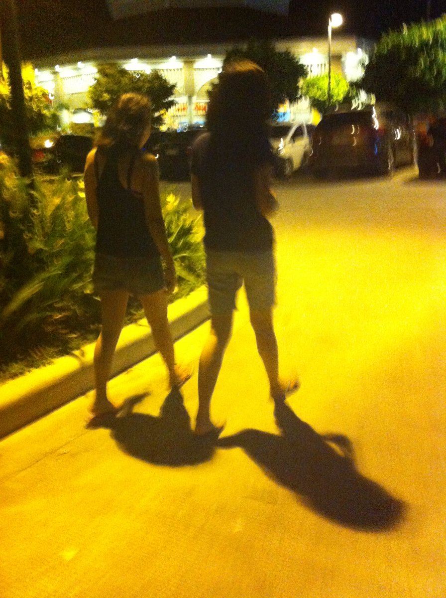 girls in black walking