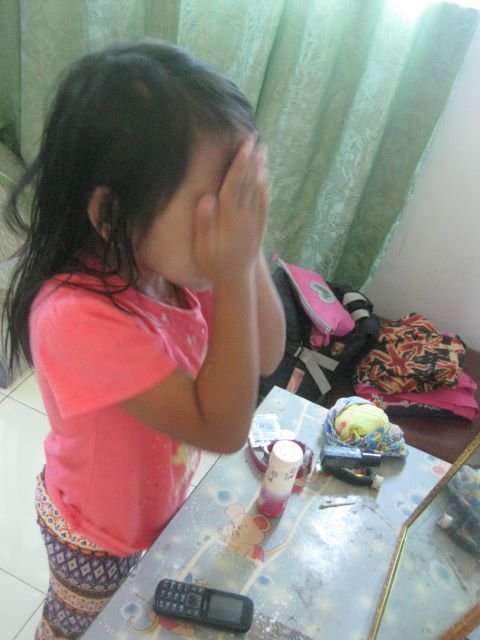 mikang covering her face