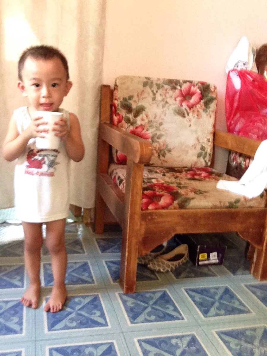 skim baby gaven holding a cup of water