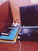 cellphone, books, charger, laptop