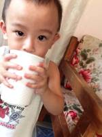 skim baby gaven holding a cup of water