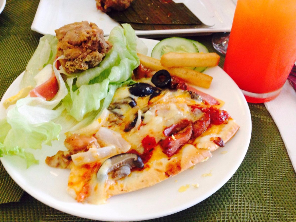 whats for snacks a sliced pizza chicken vegetable salad fries four seasons juice