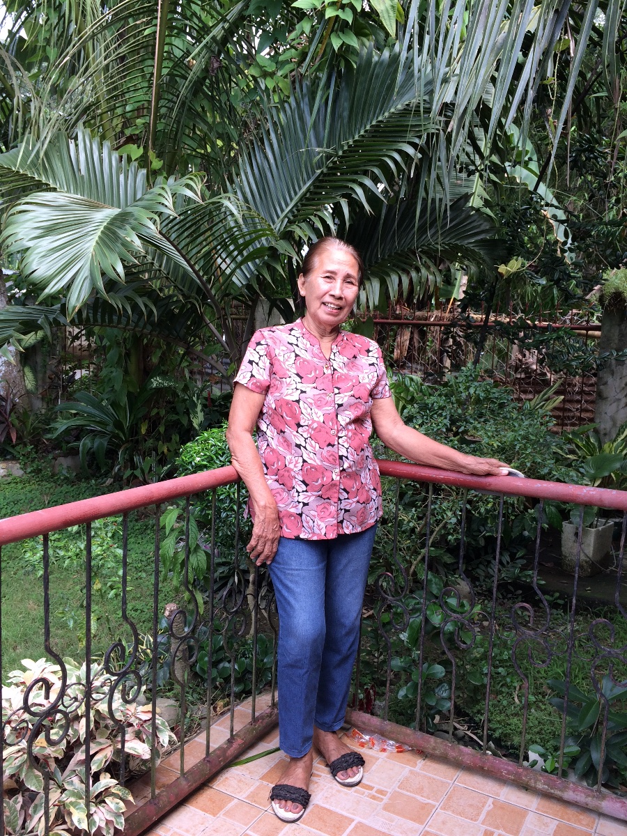 Lola wants to take a picture with her grown plants