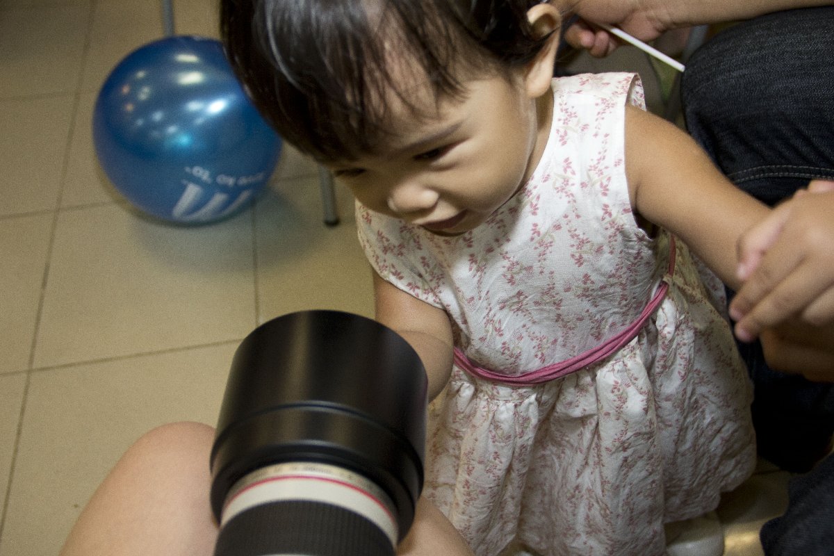 Little sis with the usual touching things