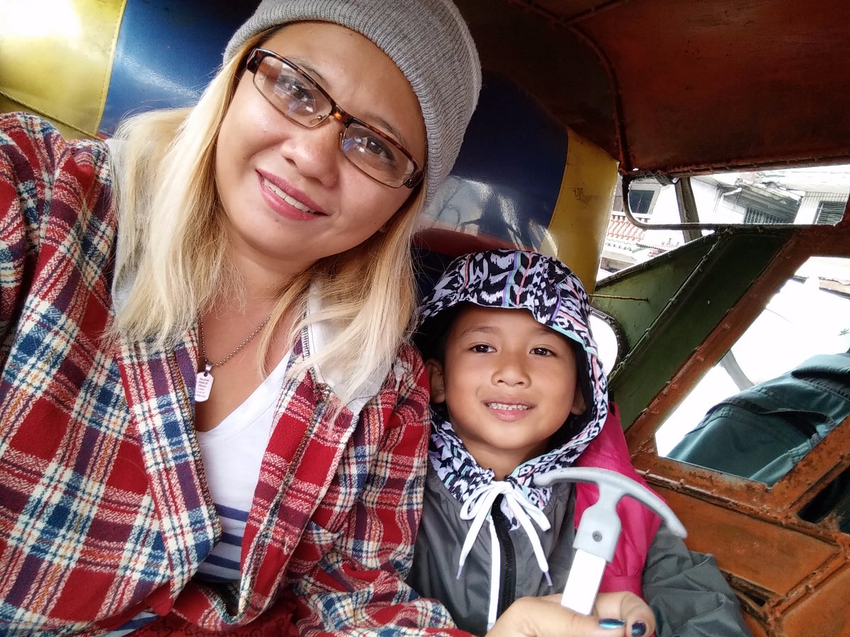 Tricycle selfie on a rainy day