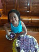 the happiness of baby irich eating a cake