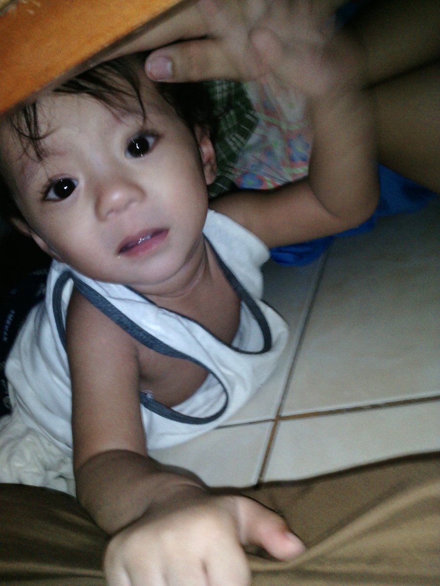 Baby boy under the bed