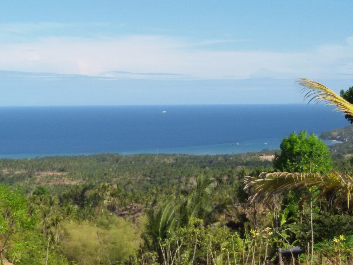 the sky kissing the sea and hugging the land