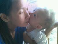 a kiss from a son to his mother he just love to kiss me