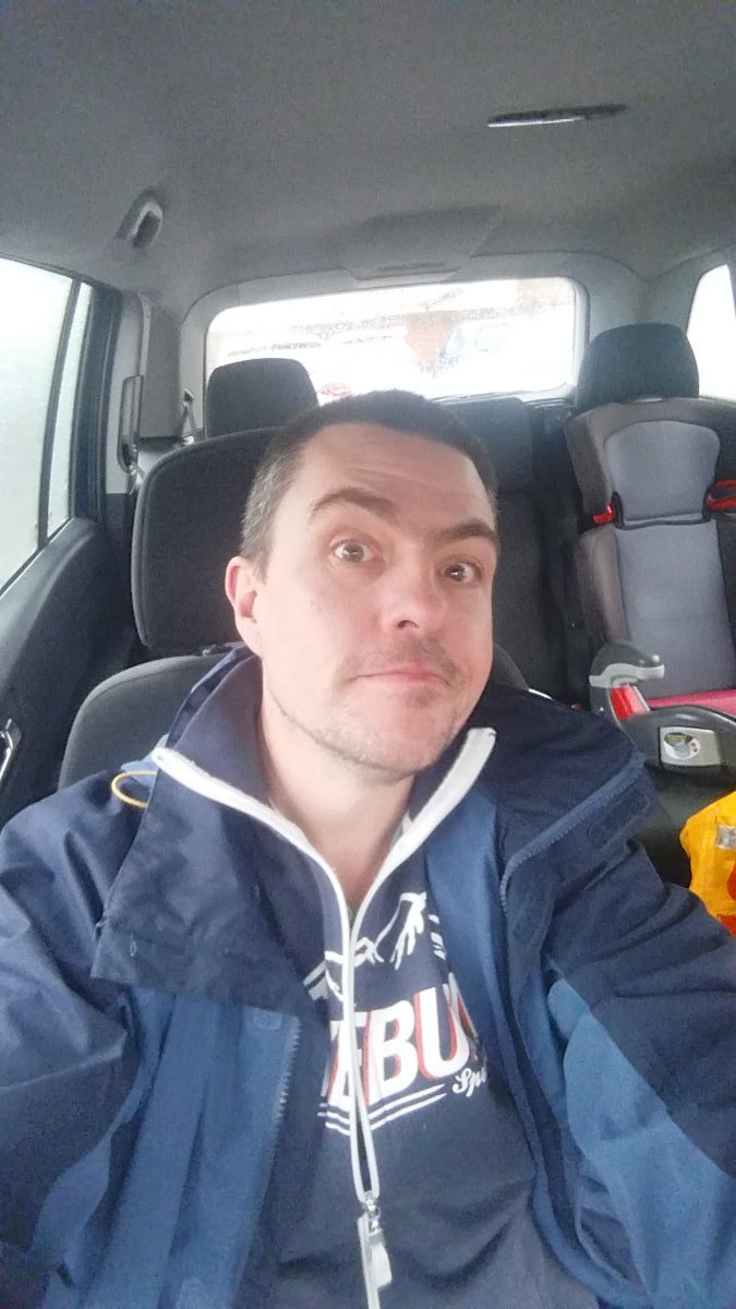 Sat in me car