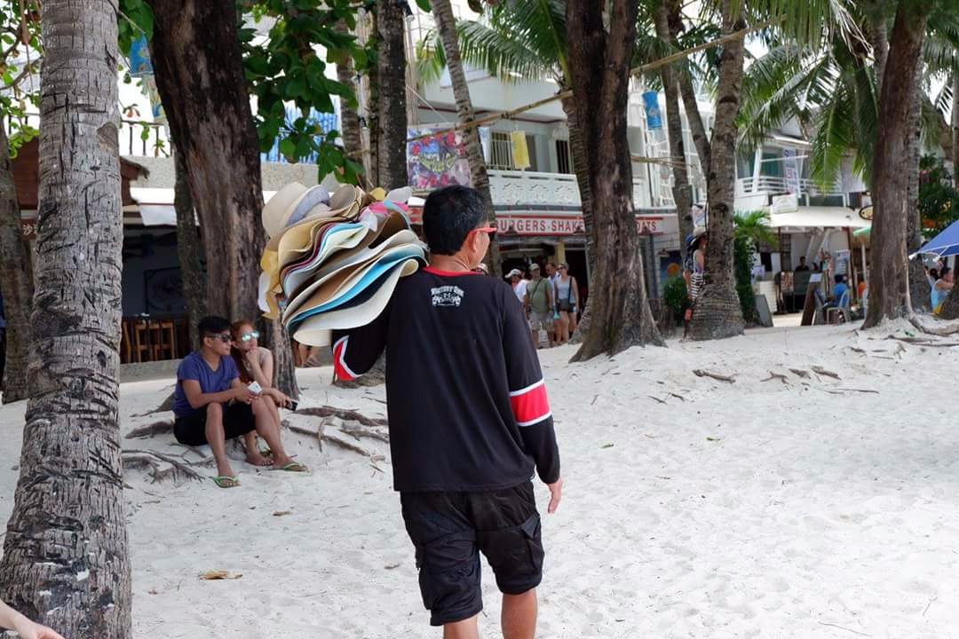 Kuya, the hat vendor