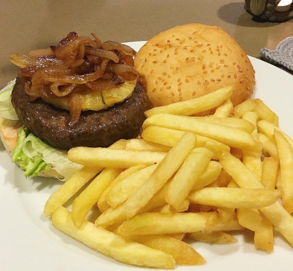Prepared dinner for mi amore Homemade wagyu Hawaiian burger topped with caramelized onion and some fries
