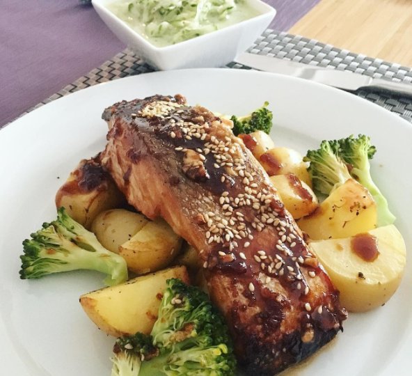 Simple euroasian dish for dinner Baked teriyaki glazed salmon belly with potatoes broccoli and cucumber salad