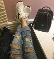ripped jeans. skins showing