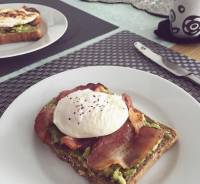 Quick photo op before A gets fed. Avocado, bacon and poached egg on a toast. So easy and delish 