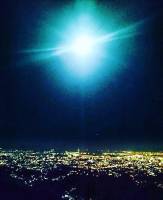 Caught between the moon and the Cebu City lights