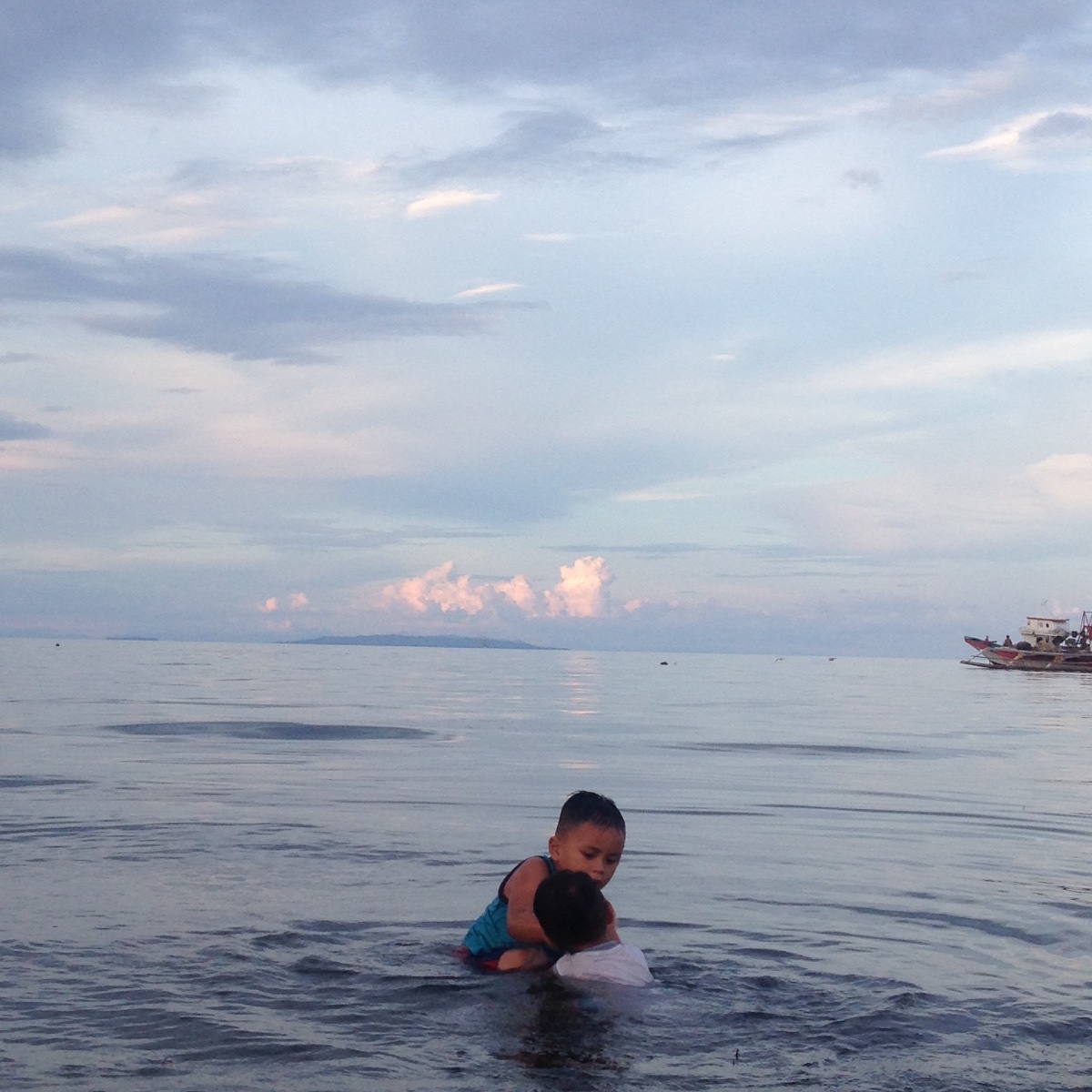 Kids, playing at the sea