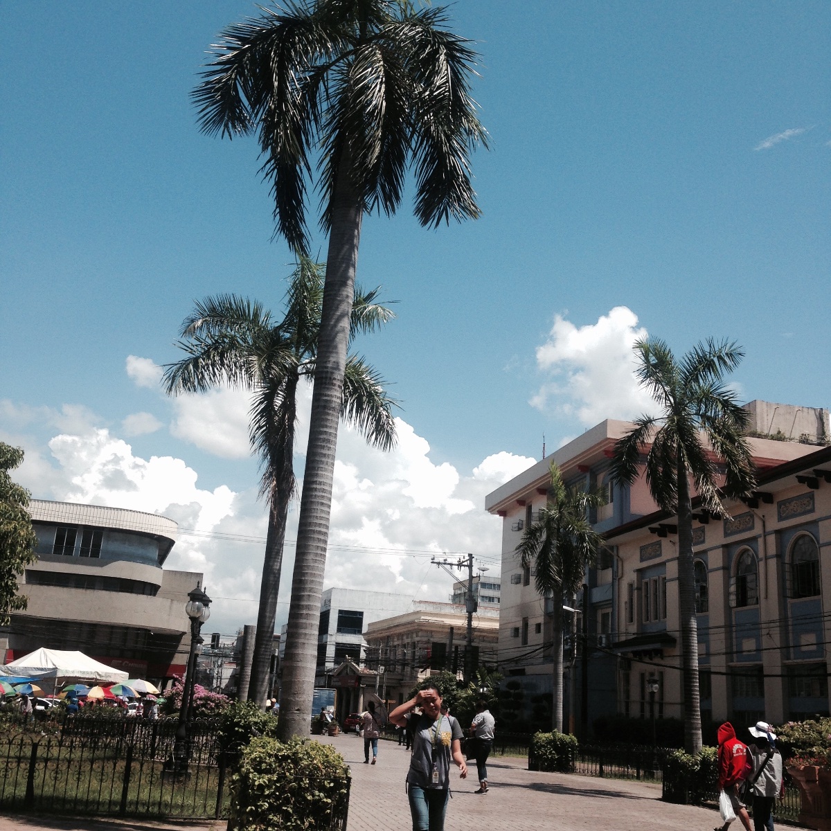 Walking under the heat of the sun, sweating, On the way to Basilica Del Sto. Nino