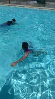 teaching him to swim