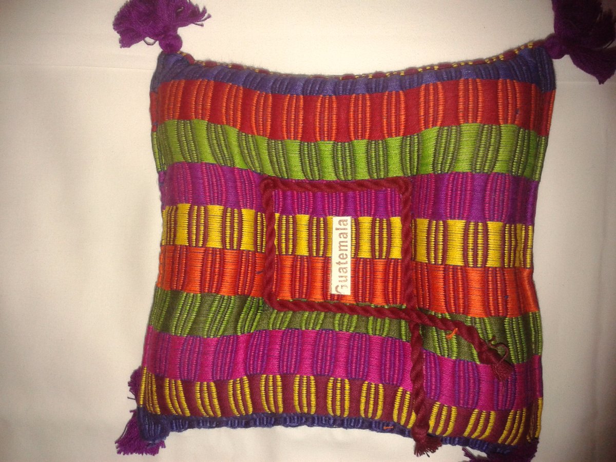 candle holder filled with herbs and spices from guatemala